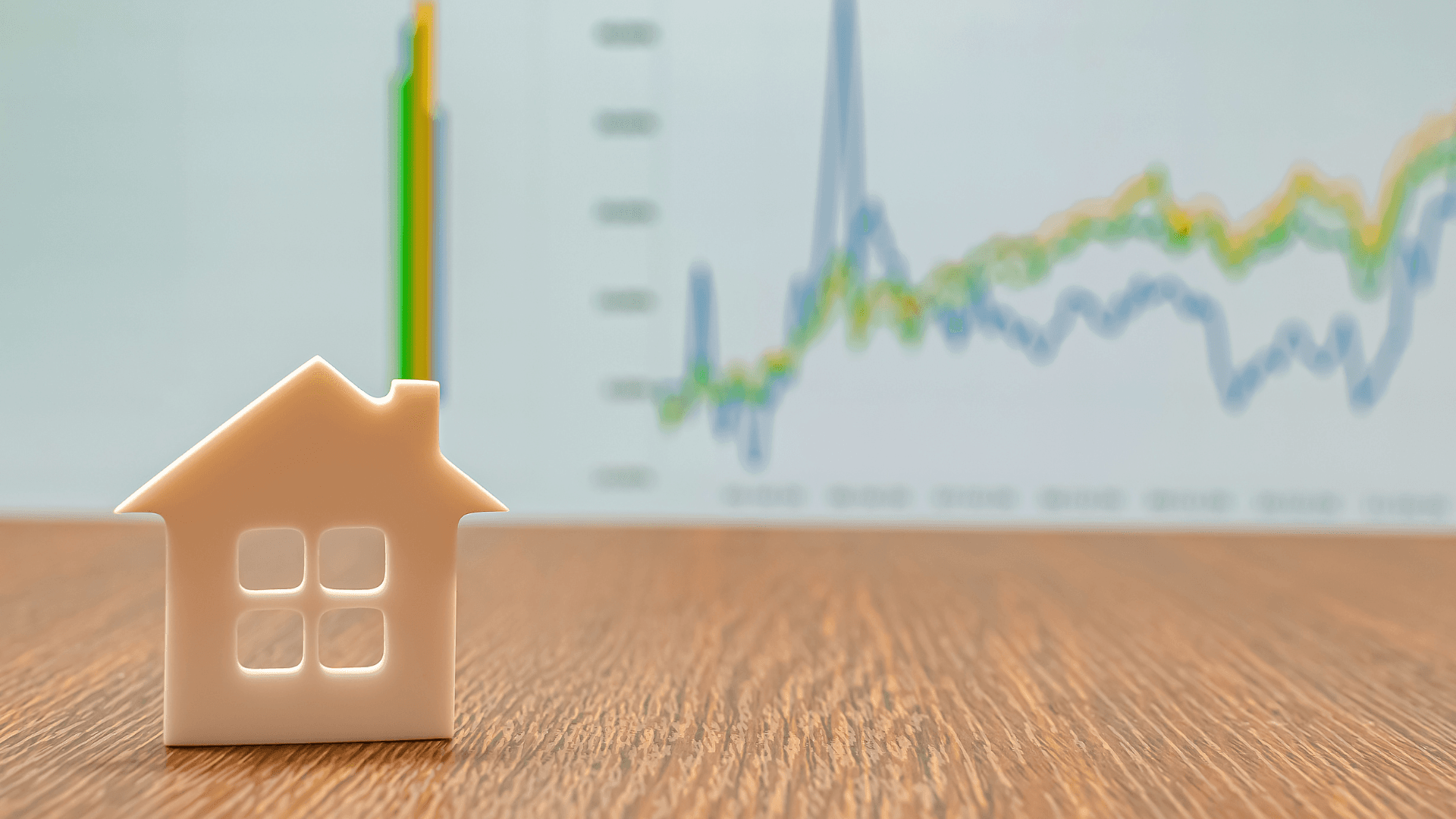 Picture of House and Chart Showing fluctuation in the housing market